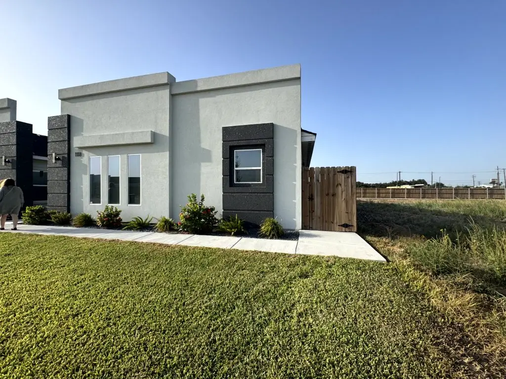 Side exterior and lawn at 1118 Country Club Drive