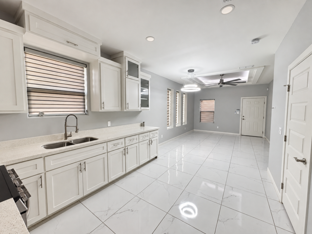 Kitchen counter and cabinetry looking toward the living area